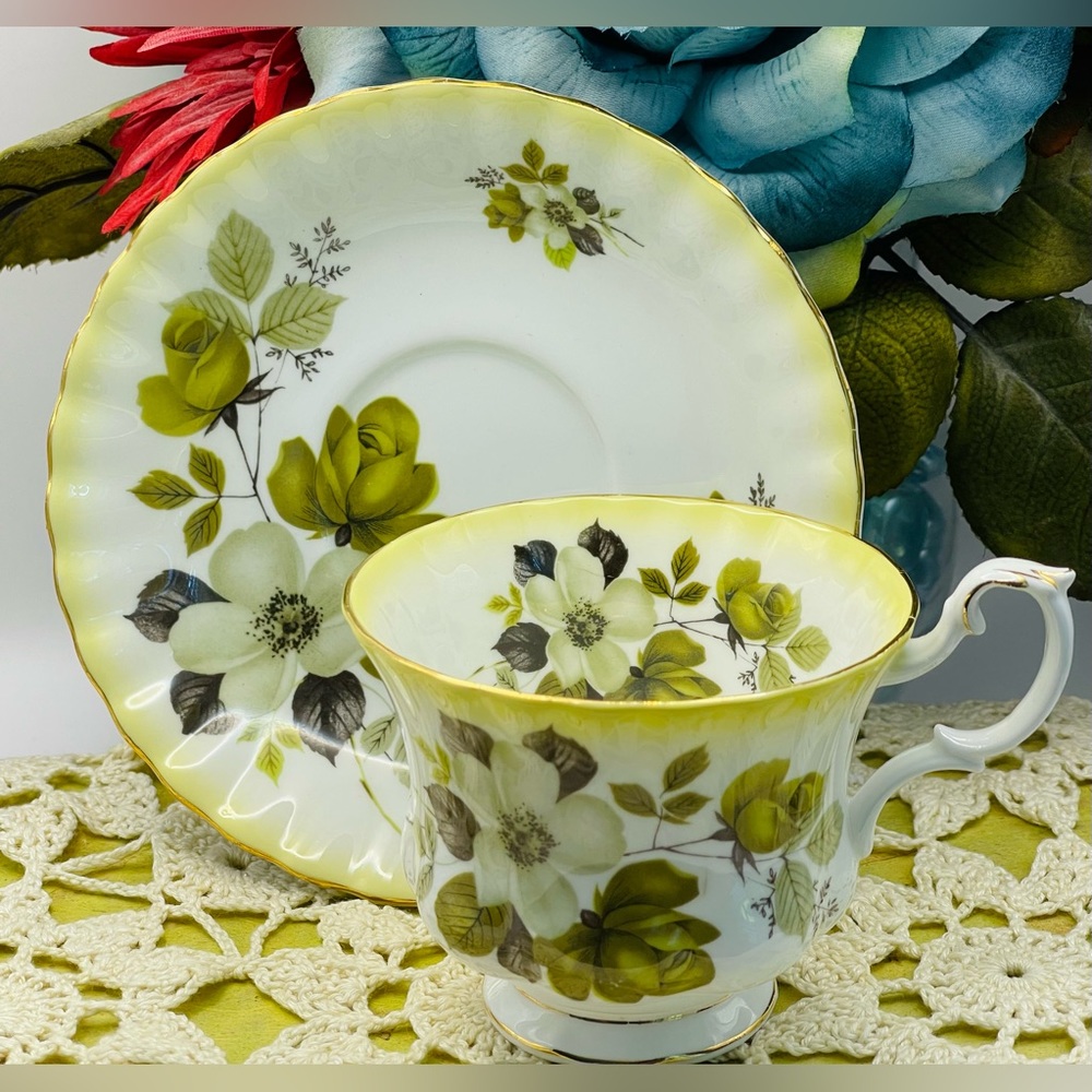 ROYAL ALBERT Yellow And Gold Trim With White And Green Roses.